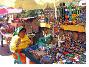 A woman sells goods in San Francisco (also known as San Poncho, Mexico