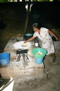 Woman makes tortillas