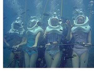 Women walking on ocean floor